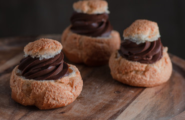 Still life with cakes. On a wooden plate