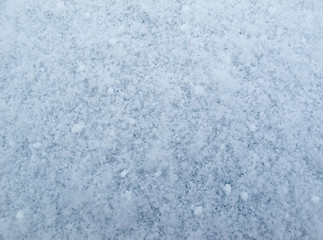 Fototapeta na wymiar Background of fresh snow. Natural winter background. Snow texture in blue tone