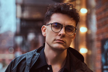 Portrait of a young handsome man outdoors.