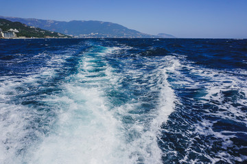 Yalta, Crimea, Russia. Black sea surface with white foam.