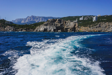 Yalta, Crimea, Russia. Black sea surface with white foam.