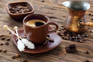 Cup of black coffee with crystal sugar