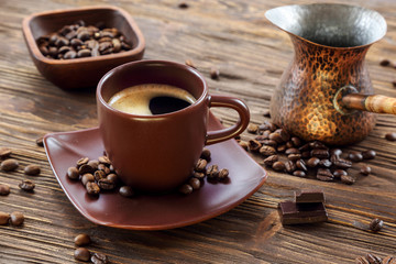 Cup of black coffee with chocolate