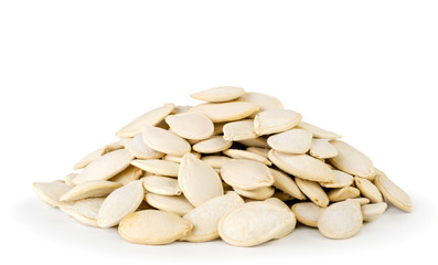 Bunch of pumpkin seeds on a white, isolated.