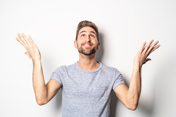 Fototapeta premium A nice guy in studio white, pointing something