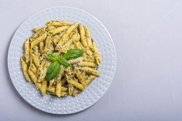 Italian penne pasta with sauce pesto