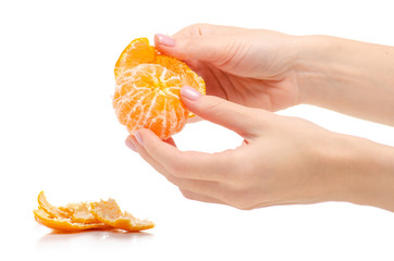 Mandarin tangerine in hand on a white background isolation