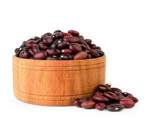 Red beans in wooden plate on a white. Isolated.