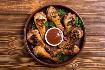 Grilled chicken legs with tomato sauce BBQ food background