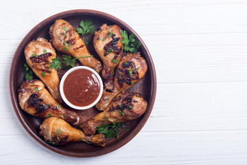 Grilled chicken legs with tomato sauce BBQ food background