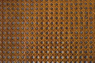Close up of the pattern formed by open weave rattan cane