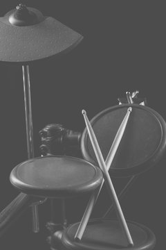 Drum sticks are on the electronic drum. Theme music.    