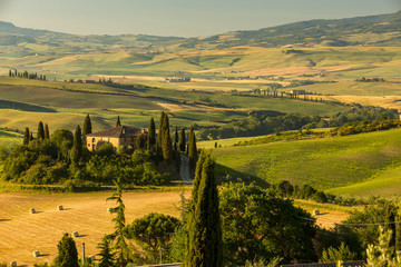 Naklejka premium A lovely farmhouse in the morhing sun, San Quirico d'Orciain, Italy