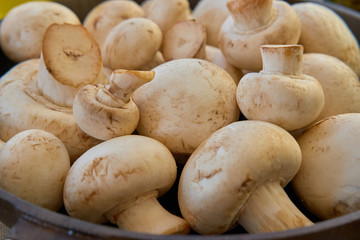 Champignon mushrooms in a cast iron skillet