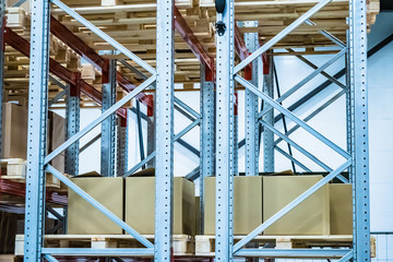 Warehouse automation. Boxes are shelves. Warehousing. Logistics in stock. Sliding warehouse shelves. Boxes on pallets. Metal shelves.