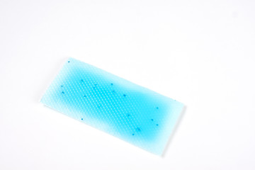 Cooling fever patch gel on hot forehead from high temperature on white background. Isolated, free space for text
