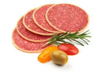 Salami sliced. Raw smoked sausage slices with herbs, isolated on a white background. Close-up