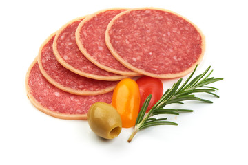Slices of French smoked salami with herbs, isolated on a white background. Close-up.