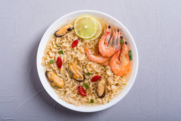 Instant noodles soup with shrimps and mssels . Asian food