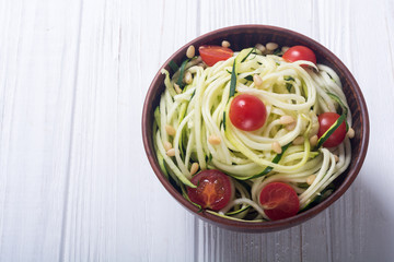 Zucchini pasta noodles with tomatoes . Healthy vegetarian food