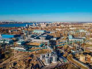 Chemical factory industrial area. Aerial view. Large vats connected by pipeline 