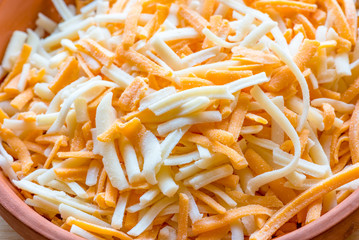 A mix of cheddar and mozzarella cheese