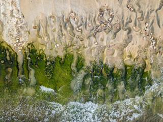 Aerial top view of beautiful Balangan beach. Unique texture in the coast, photo from drone. Bali, Indonesia.