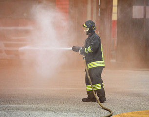 fireman extinguishes the great fire with the hydrant