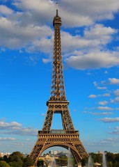 Fototapeta premium high eiffel tower with very bright colors and white clouds in th