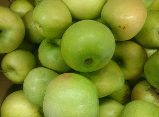 Green apple fruits in a supermarket