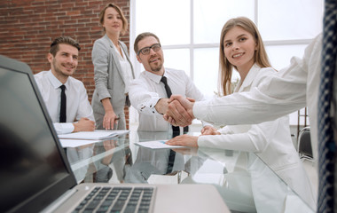 business people shaking hands at the office table.