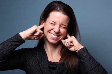 Portrait of a woman in front of a colored background