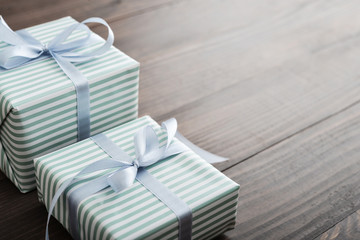 Striped gift box with blue ribbon