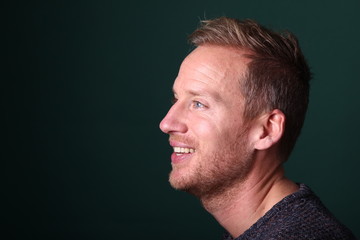 Portrait of a man in front of a colored background