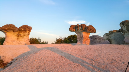 Sunrise view of Rock formation Stone Mushrooms near Beli plast village, Kardzhali Region, Bulgaria - obrazy, fototapety, plakaty