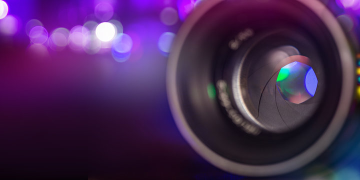 Professional camera lens with reflections.