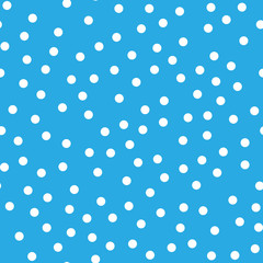 Snowy seamless patern. White dot snowflakes on blue background. Snow and Christmas theme. Abstract backround.