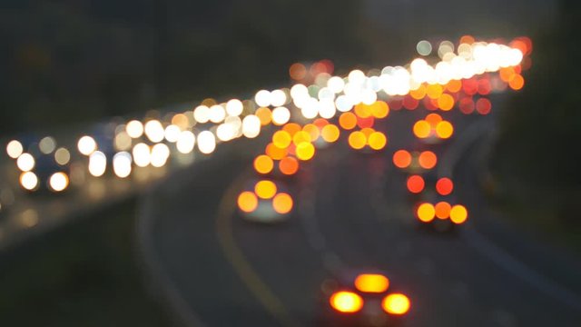 Defocused brake and headlights of highway traffic. Don Valley Parkway evening traffic in Toronto, Canada.