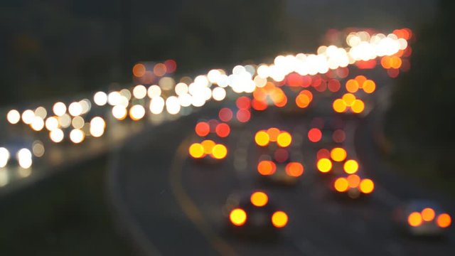 Defocused brake and headlights of highway traffic. Don Valley Parkway evening traffic in Toronto, Canada.