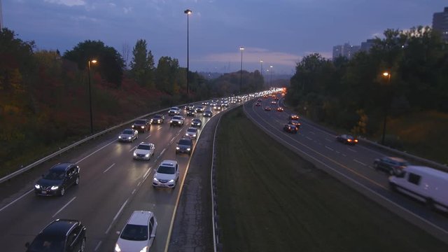 Rush hour traffic on the Don Valley Parkway. Autumn dusk in Toronto.