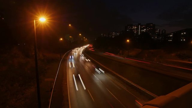 Don Valley Parkway time lapse at night. Streetlights and light trails from traffic. Toronto, Canada.