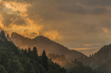 Orange sunset after storm in Lesnica village in Pieniny national park © luzkovyvagon.cz