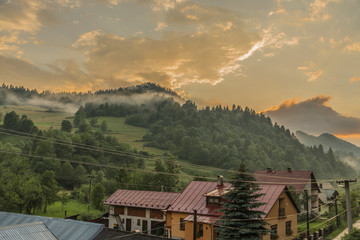 Orange sunset after storm in Lesnica village in Pieniny national park