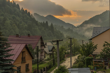 Orange sunset after storm in Lesnica village in Pieniny national park © luzkovyvagon.cz