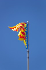 Flag of the Valencian Community waving in the wind