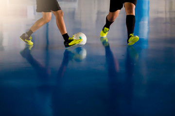 Indoor soccer sports hall. Football futsal player, ball, futsal floor.