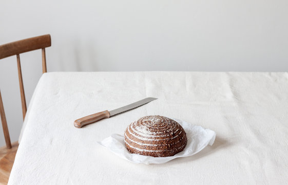 Loaf of sourdough bread on table