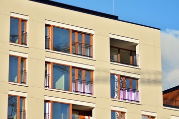 Modern apartment buildings on a sunny day with a blue sky. Facade of a modern apartment building