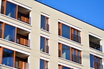 Modern apartment buildings on a sunny day with a blue sky. Facade of a modern apartment building