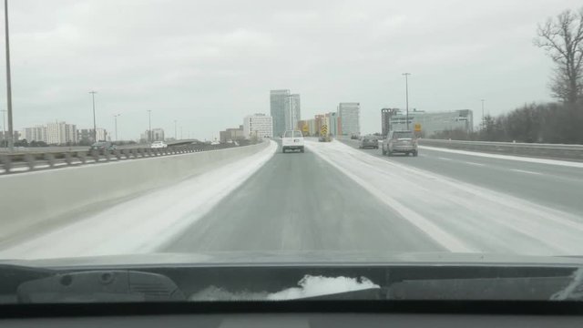 Leaving the Don Valley Parkway going north to join Highway 401 in Toronto, Canada. Winter driving with salt on the road.